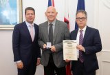 CM & DCM present Gibraltar Medallion of Distinction to Kenneth Saez